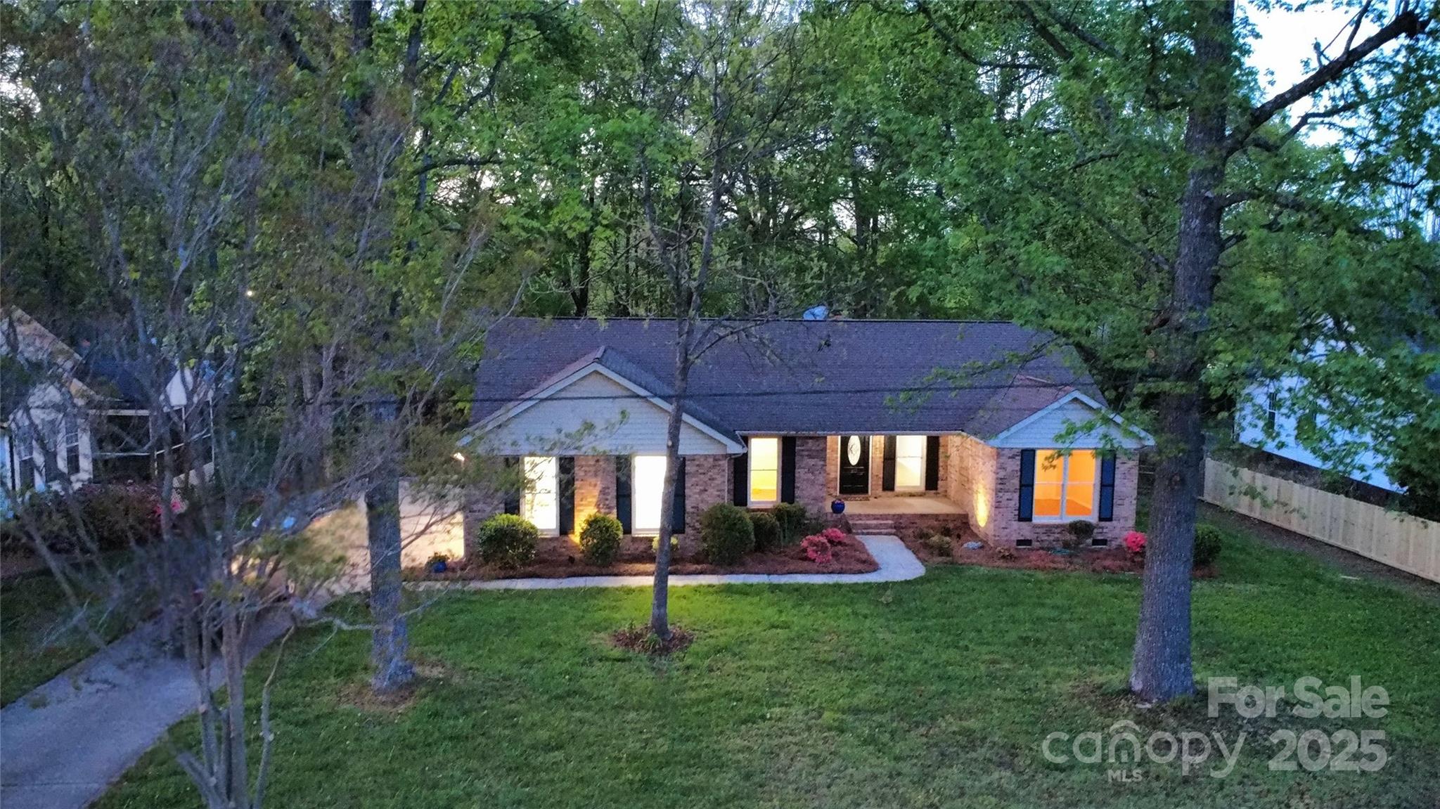 413 Parallel Drive Harrisburg, NC 28075 - Photo 40 of 40 a front view of a house with garden