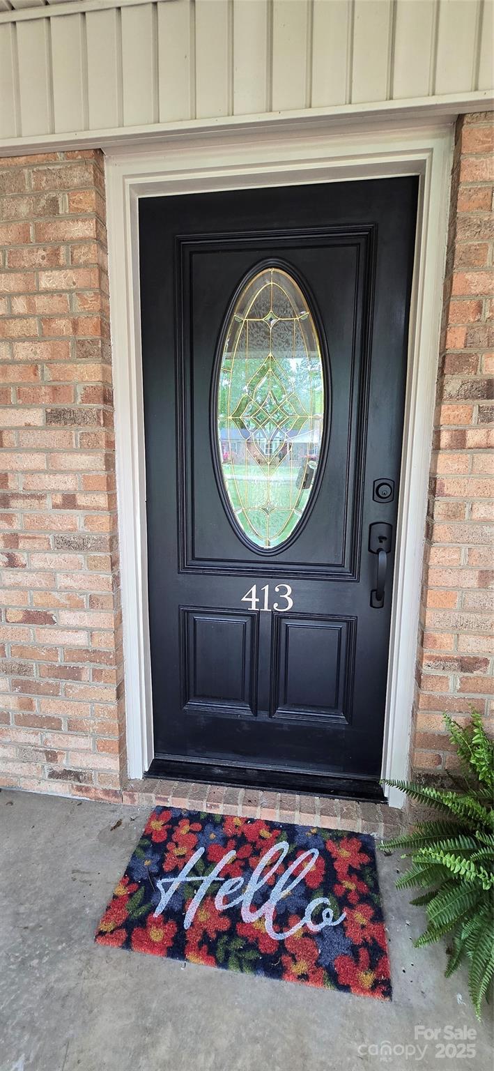 413 Parallel Drive Harrisburg, NC 28075 - Photo 4 of 40 a front view of a house with garden
