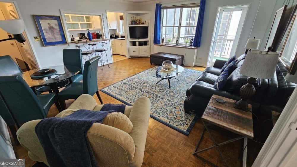 a living room with furniture and a window