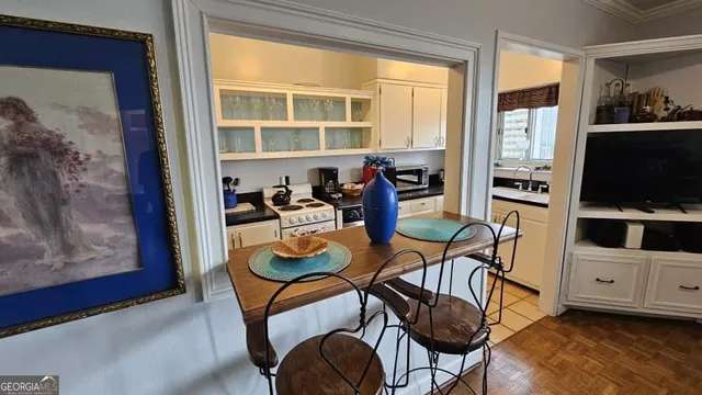 a dining room with furniture and window