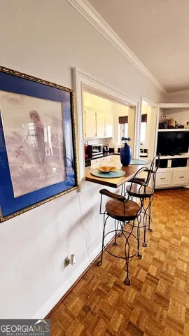 a view of a dining room with furniture and window