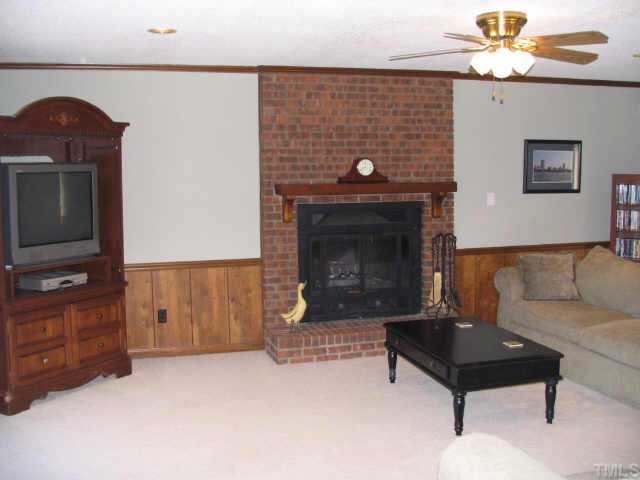 7500 Old Hundred Road Raleigh, NC 27613 - Photo 4 of 9 a living room with furniture and a fireplace