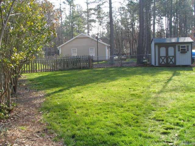 7500 Old Hundred Road Raleigh, NC 27613 - Photo 8 of 9 a view of a house with a yard