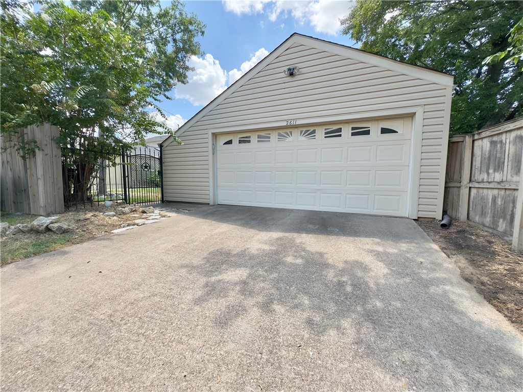 2611 Rustling Oaks Drive Bryan, TX 77802 - Photo 43 of 43 a front view of a house with a garage