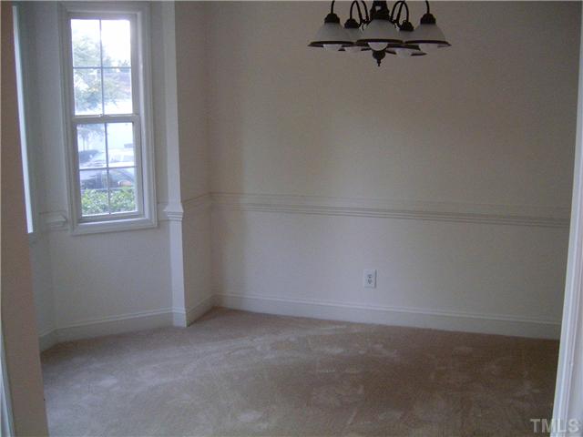 4017 Beaufain Street Raleigh, NC 27604 - Photo 8 of 8 an empty room with a window