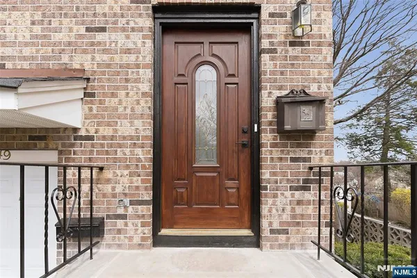 a front view of a house with parking space