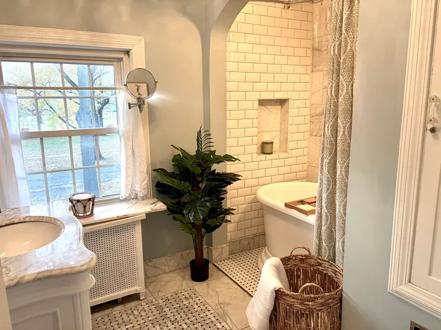 a bathroom with a sink toilet and tub