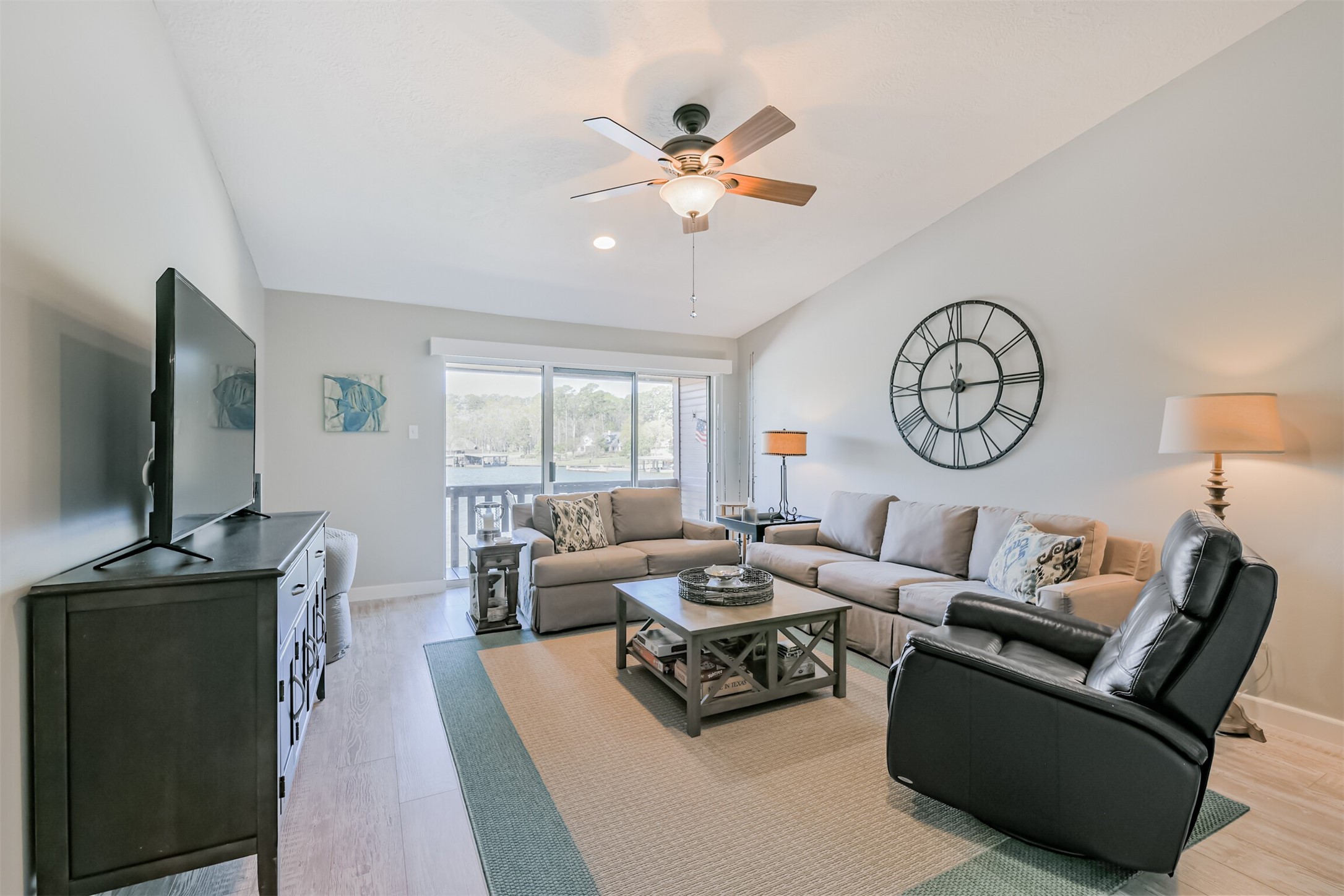 Living room offers wonderful views of the lake, high ceiling and opens to the kitchen. Second floor unit offer privacy, peace and quiet.