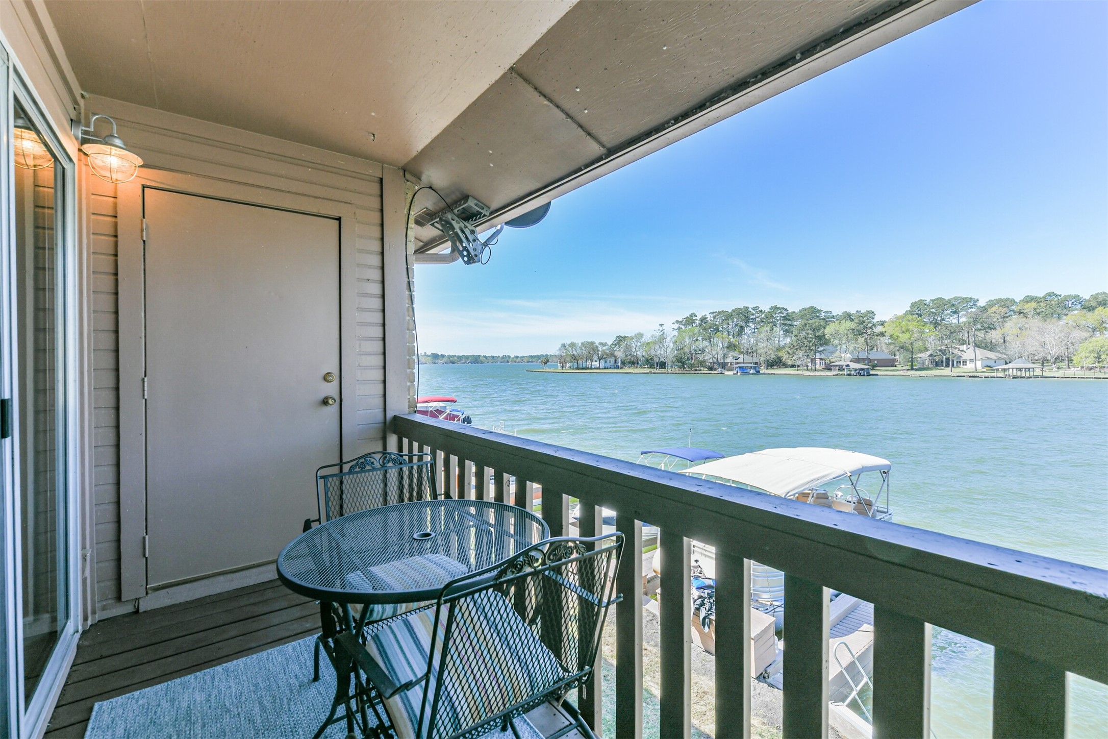 801 River Road, Unit 106F Montgomery, TX 77356 - Photo 25 of 39 Another view of the back balcony and Storage Locker