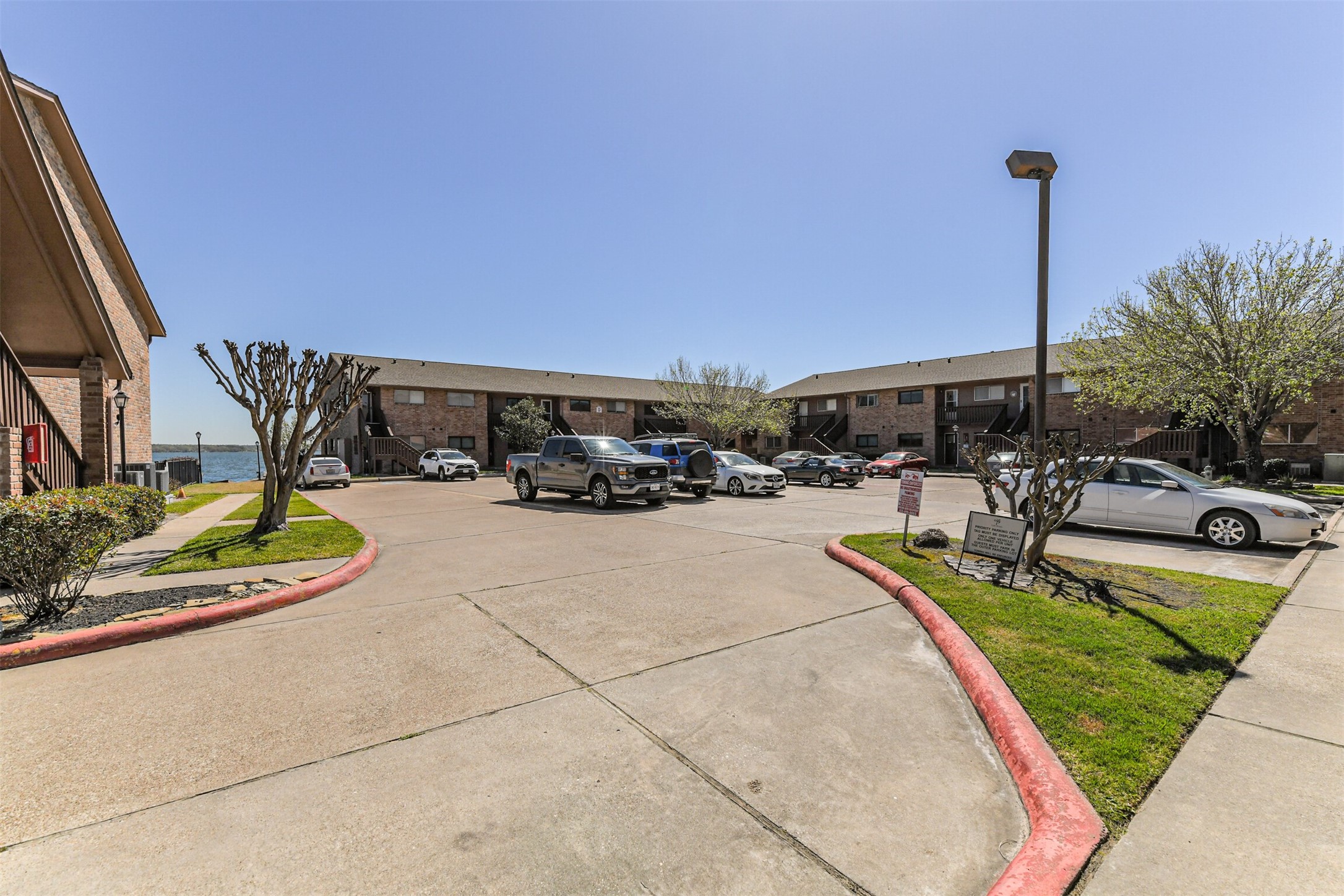 801 River Road, Unit 106F Montgomery, TX 77356 - Photo 37 of 39 Interior Parking Lot