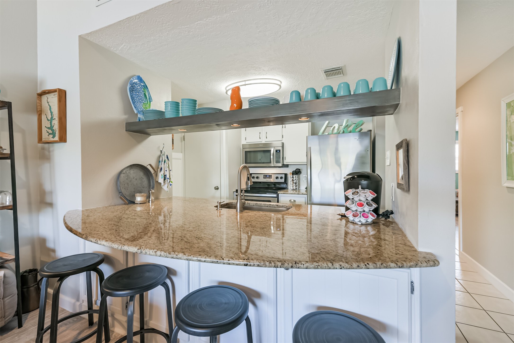 801 River Road, Unit 106F Montgomery, TX 77356 - Photo 5 of 39 Oversized counter offers breakfast bar from LR