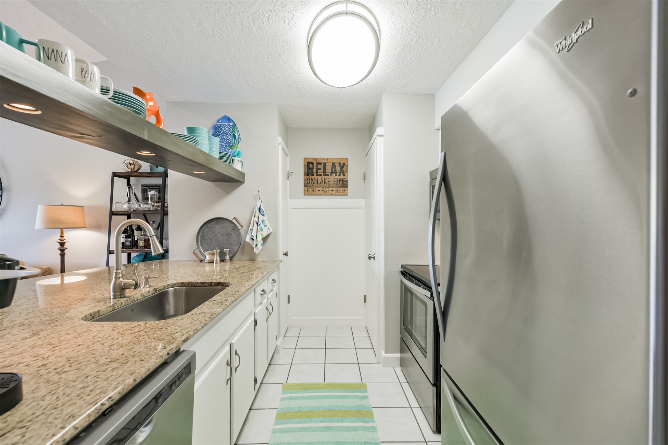 801 River Road, Unit 106F Montgomery, TX 77356 - Photo 6 of 39 Built-in pantry and laundry.