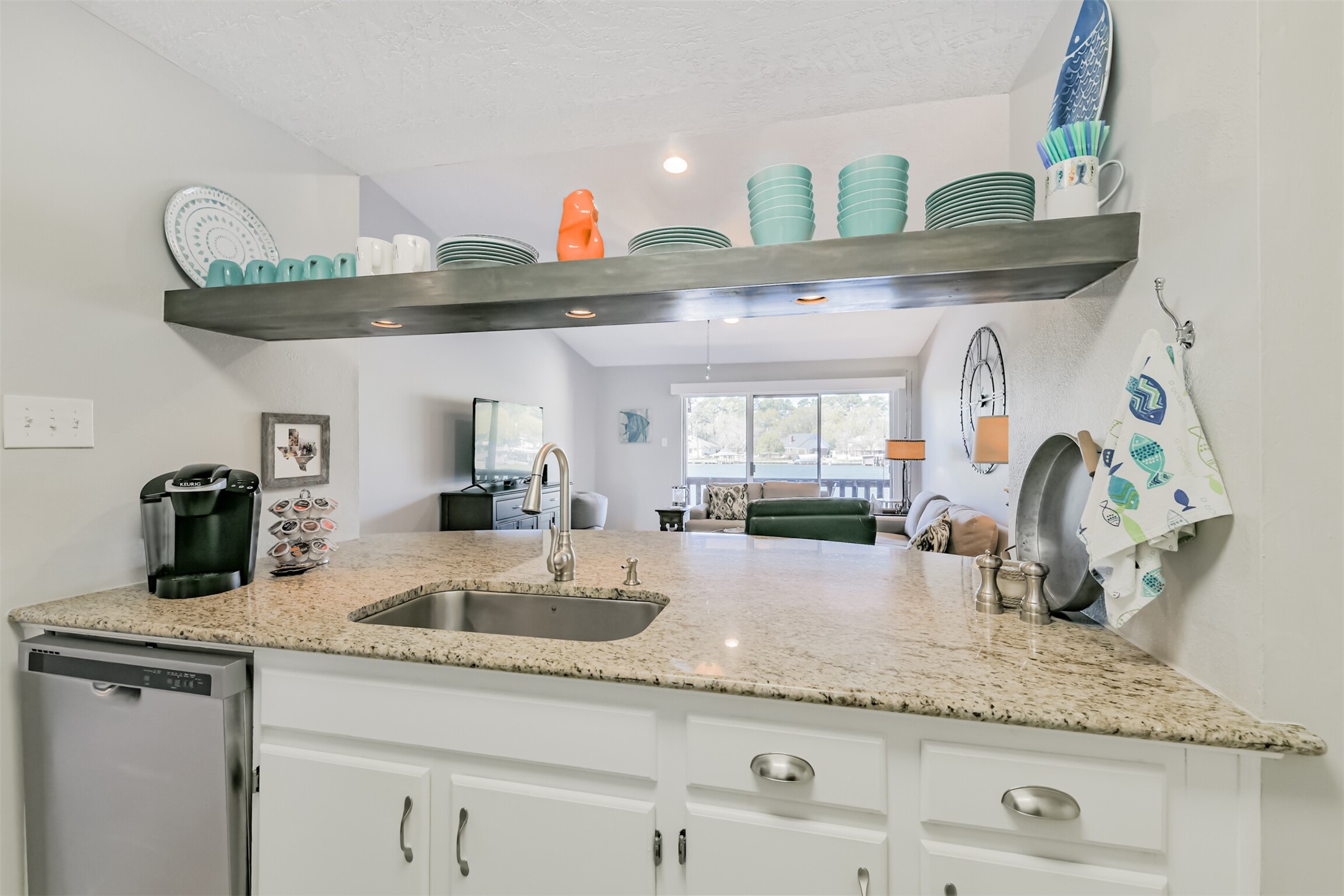 801 River Road, Unit 106F Montgomery, TX 77356 - Photo 9 of 39 Doing dishes is easy when you're looking at the lake...