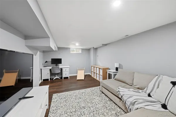 a bedroom with a large bed and dresser