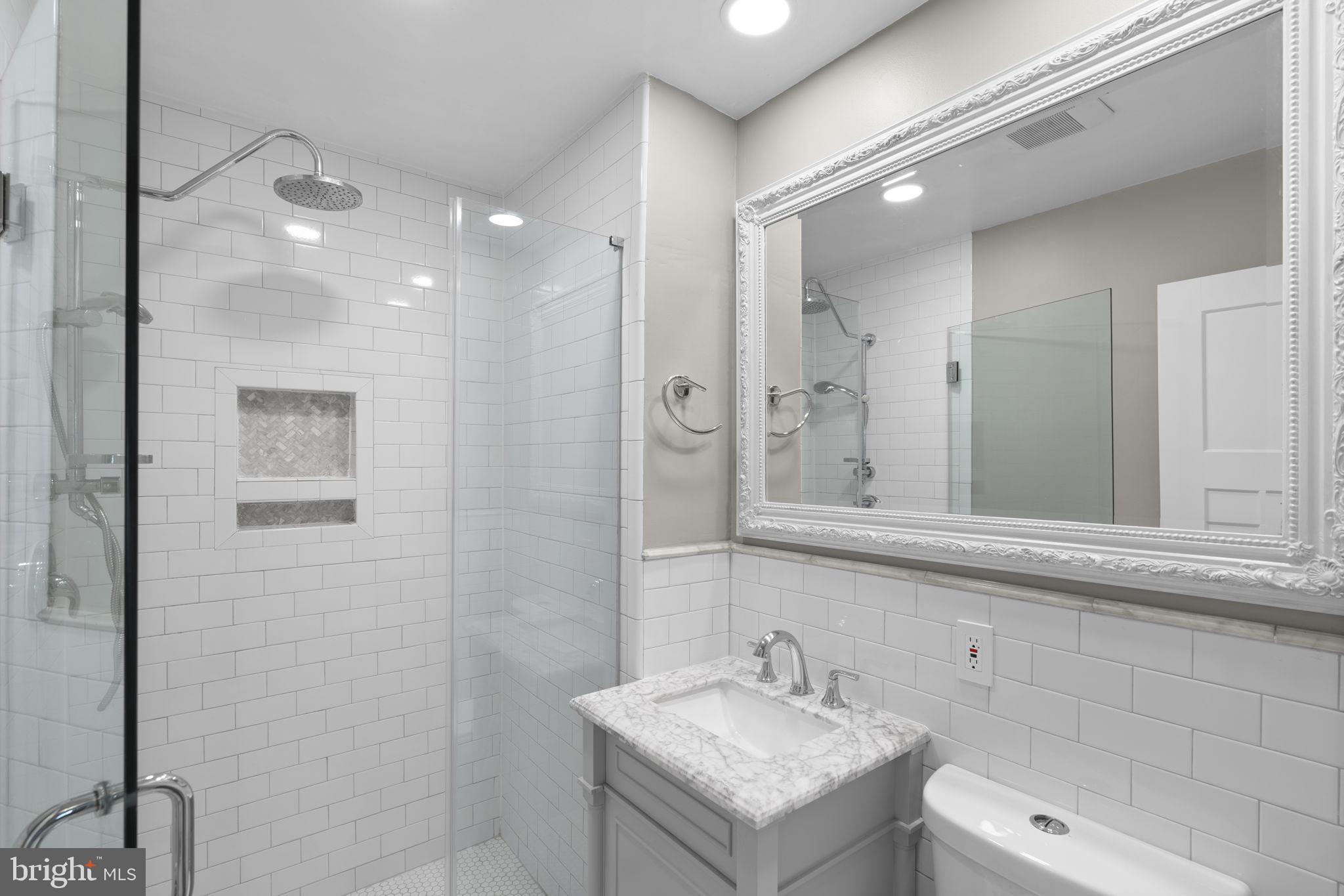 822 Loxford Terrace Silver Spring, MD 20901 - Photo 27 of 61 a bathroom with a sink a toilet and shower