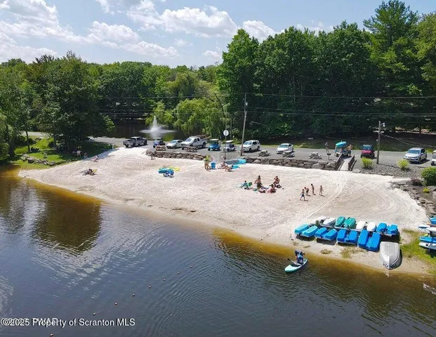a view of a swimming pool with a sitting area
