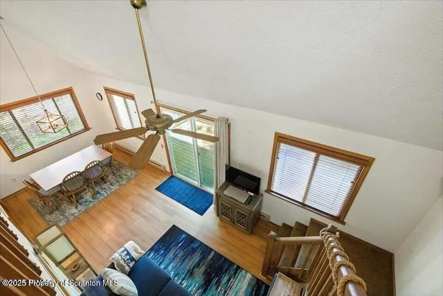 a view of living room with furniture and rug