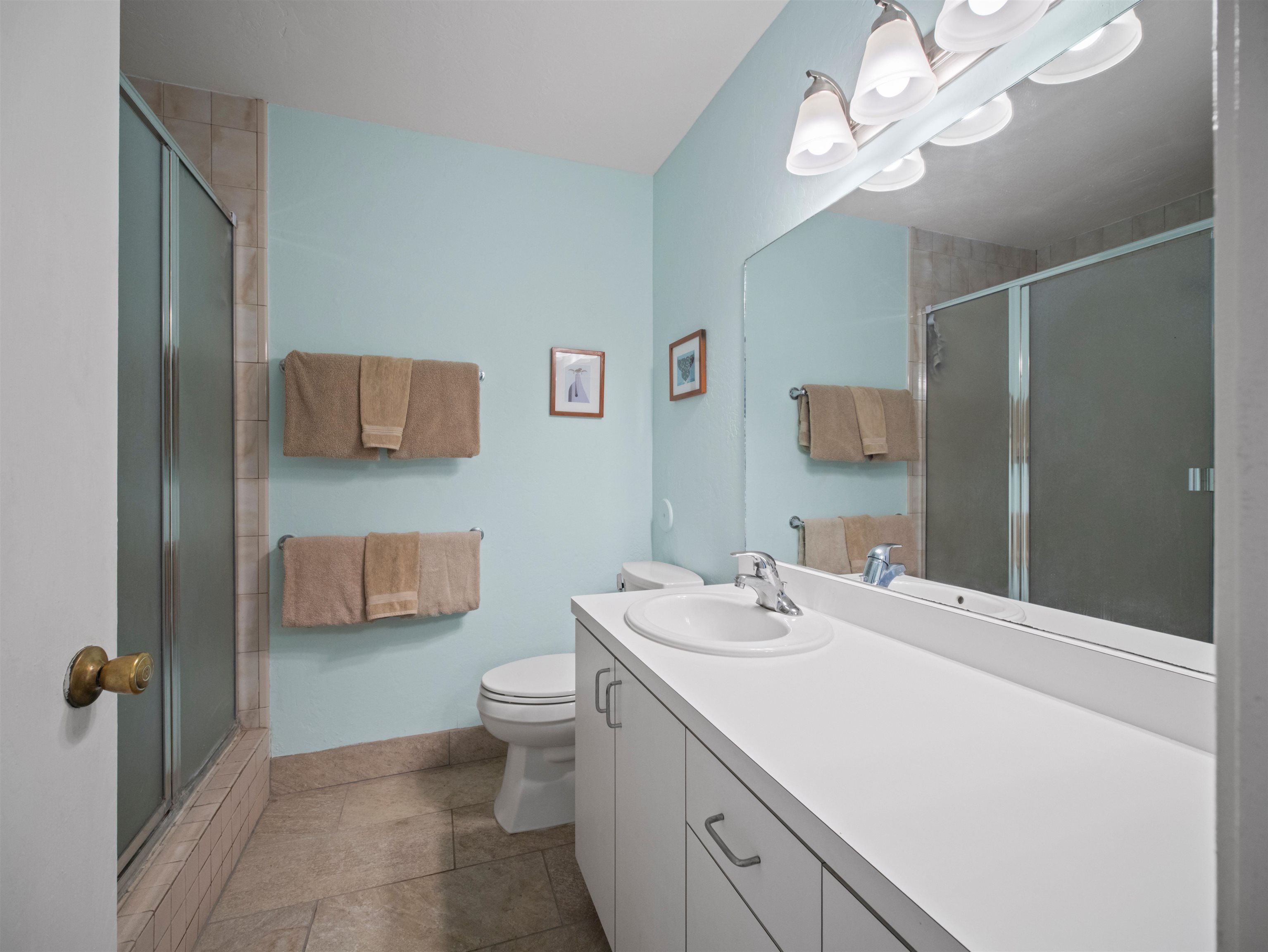 2737 South Kihei Road, Unit 1106 Kihei, HI 96753 - Photo 14 of 25 a bathroom with a sink a toilet and a large mirror