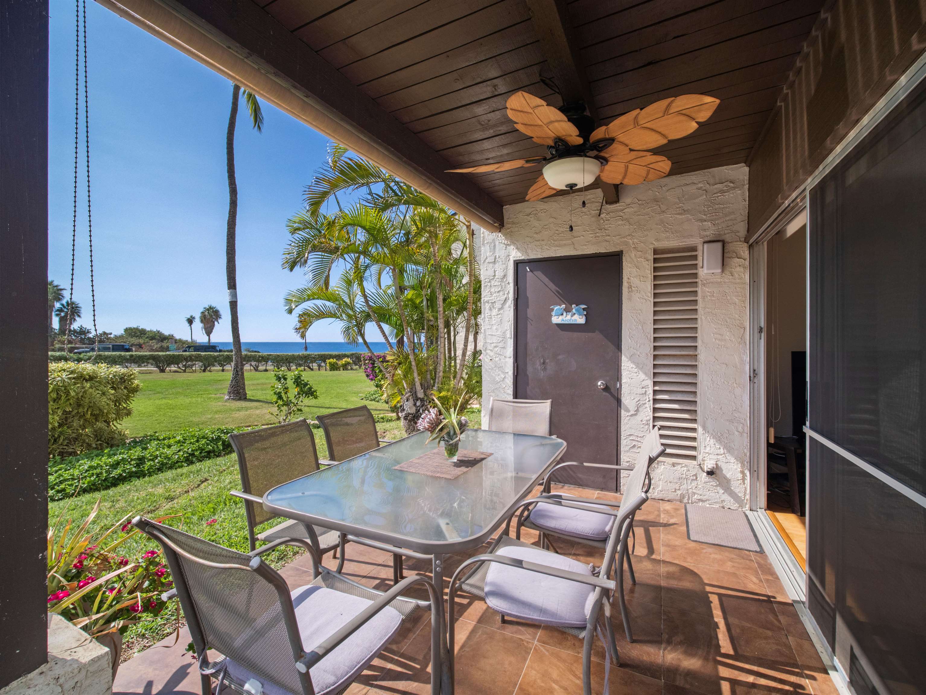 2737 South Kihei Road, Unit 1106 Kihei, HI 96753 - Photo 3 of 25 a view of a patio with a table and chairs