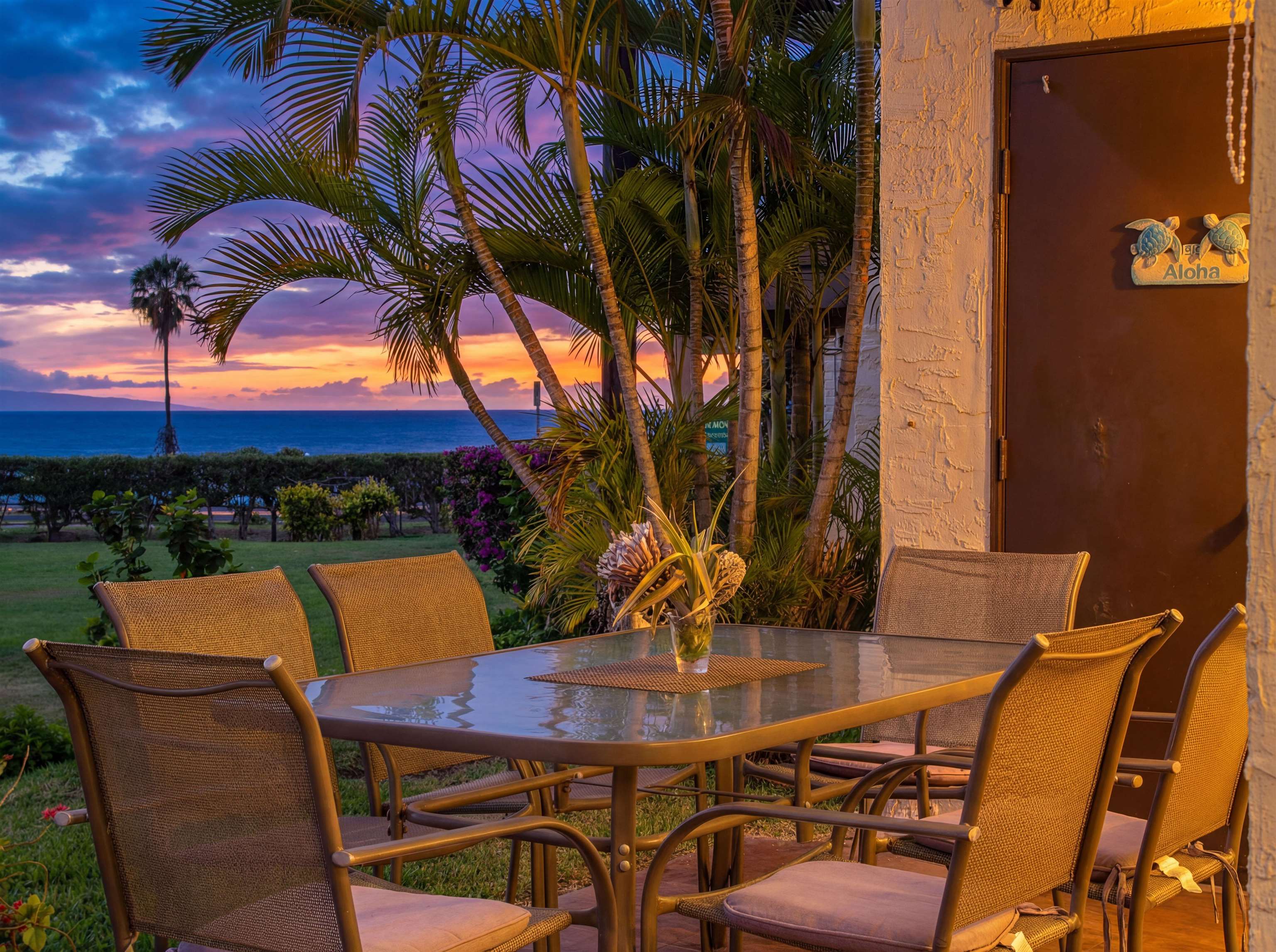 2737 South Kihei Road, Unit 1106 Kihei, HI 96753 - Photo 4 of 25 a backyard of a house with table and chairs