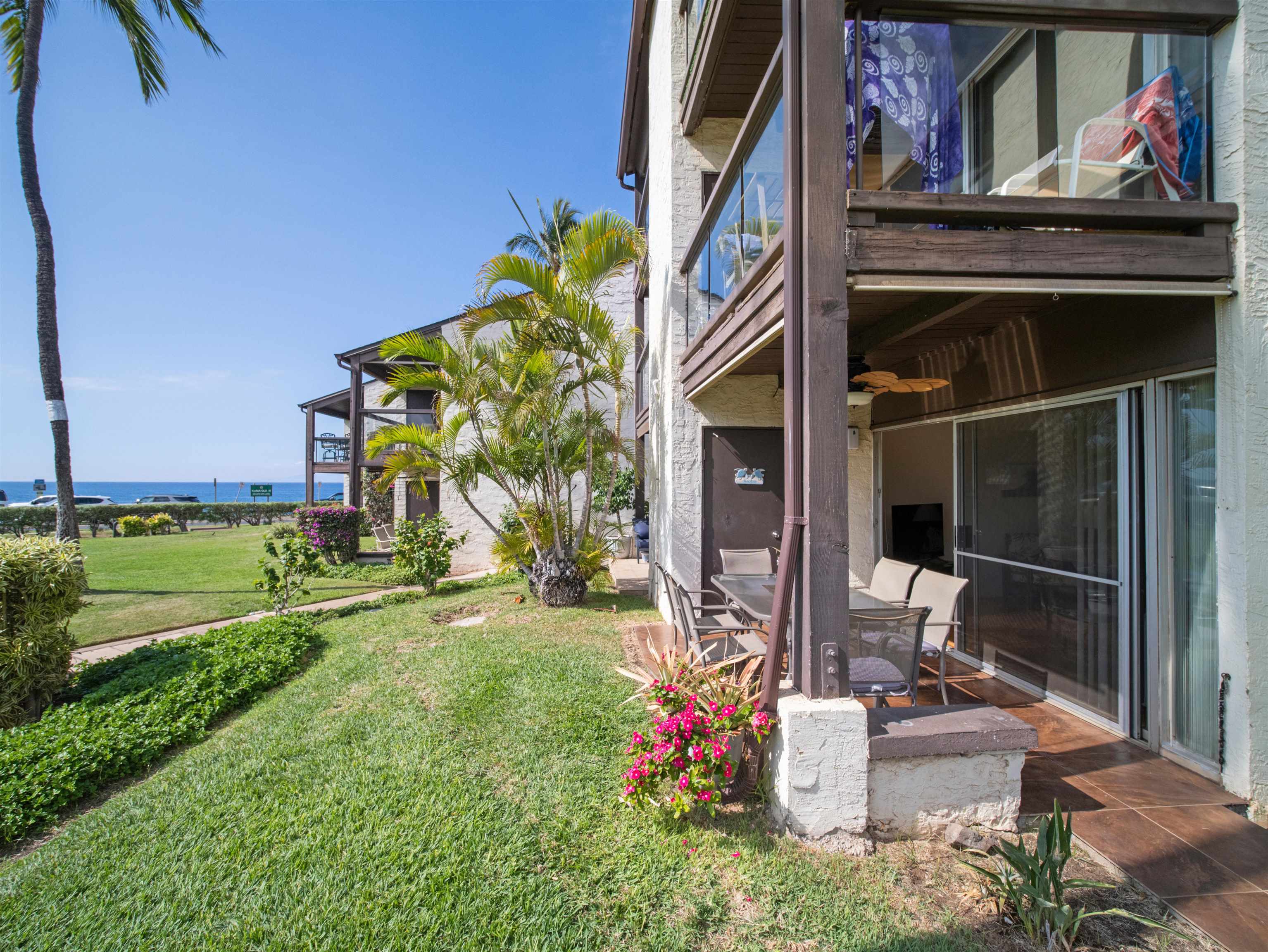 2737 South Kihei Road, Unit 1106 Kihei, HI 96753 - Photo 10 of 25 a view of a house with backyard and sitting area