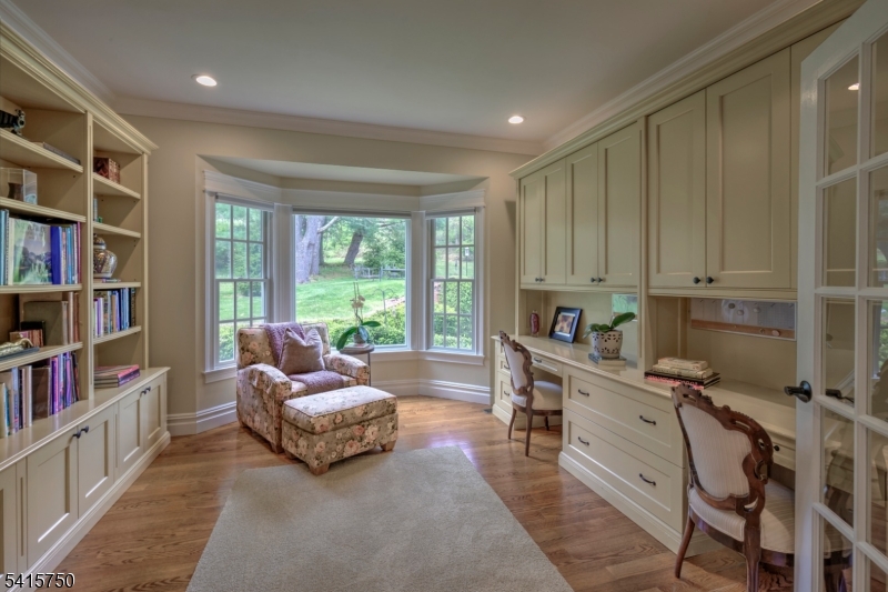 85 Mosle Road Peapack-Gladstone, NJ 07931 - Photo 18 of 49 a living room with furniture and a book shelf