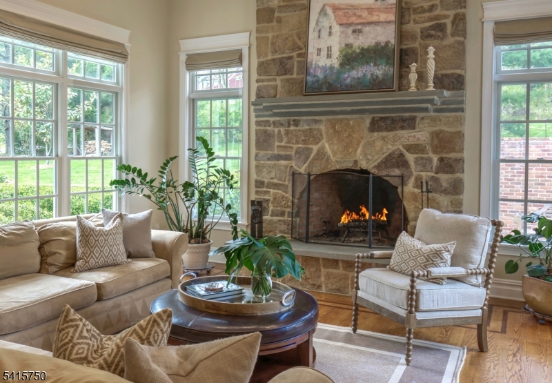 85 Mosle Road Peapack-Gladstone, NJ 07931 - Photo 20 of 49 a living room with furniture and a fireplace
