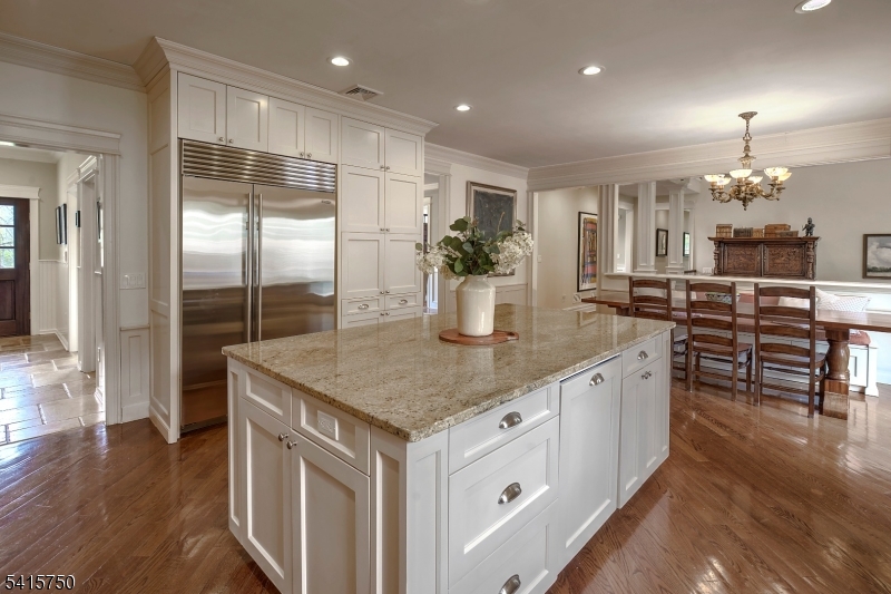 85 Mosle Road Peapack-Gladstone, NJ 07931 - Photo 24 of 49 a kitchen with stainless steel appliances granite countertop a sink counter space and wooden floor
