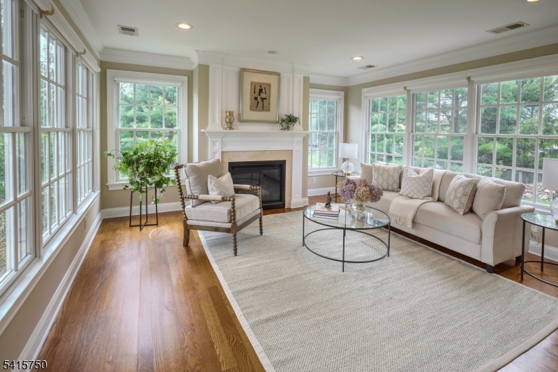 85 Mosle Road Peapack-Gladstone, NJ 07931 - Photo 31 of 49 a living room with furniture and a fireplace