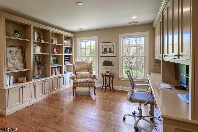 85 Mosle Road Peapack-Gladstone, NJ 07931 - Photo 38 of 49 a view of a livingroom with furniture staircase and a large window