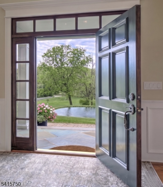 85 Mosle Road Peapack-Gladstone, NJ 07931 - Photo 4 of 49 a view of a porch with a floor to ceiling window and an outdoor view