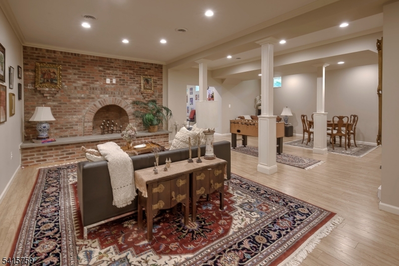 85 Mosle Road Peapack-Gladstone, NJ 07931 - Photo 41 of 49 a living room with furniture and a fireplace