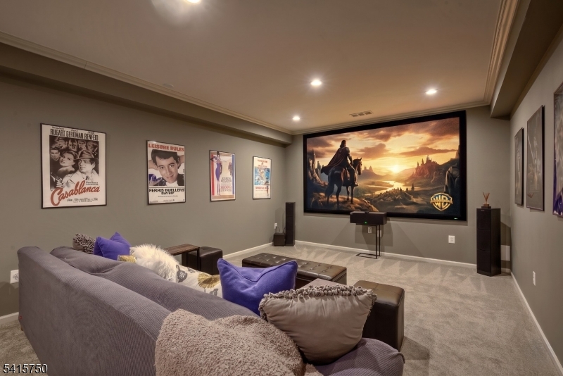 85 Mosle Road Peapack-Gladstone, NJ 07931 - Photo 44 of 49 a living room with furniture and a projector