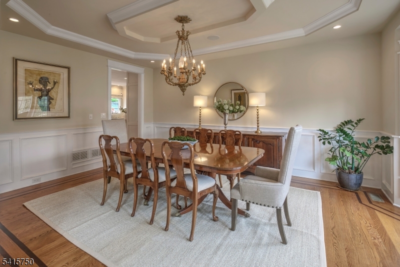 85 Mosle Road Peapack-Gladstone, NJ 07931 - Photo 10 of 49 a view of a dining room with furniture wooden floor and chandelier