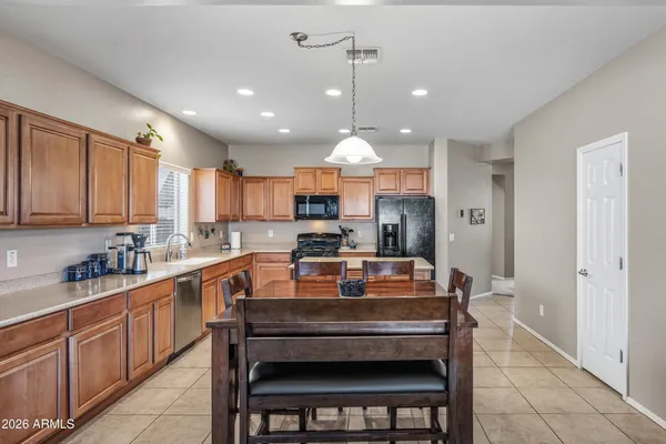 a living room with furniture a clock and a window