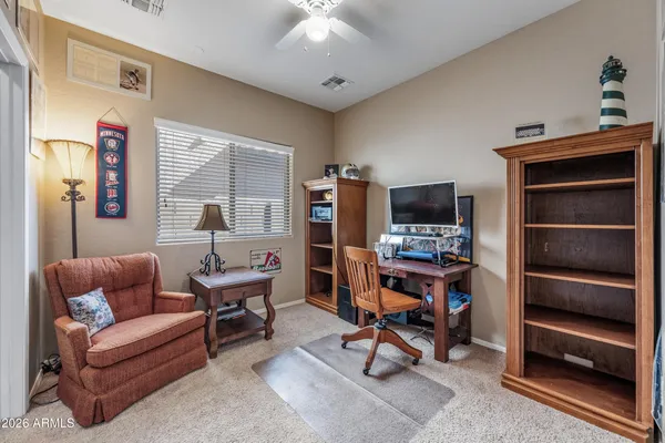 a spacious bathroom with a double vanity sink a mirror and a bathtub