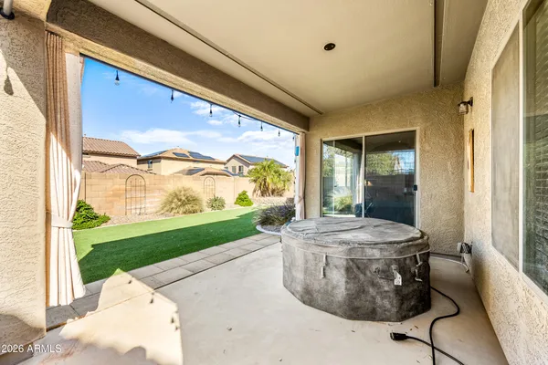 a bathroom with a sink a toilet a mirror a vanity and shower