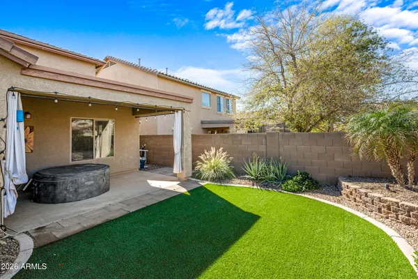 a view of a garden with a building in the background