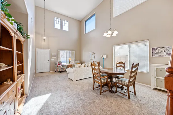 a living room with furniture and a rug
