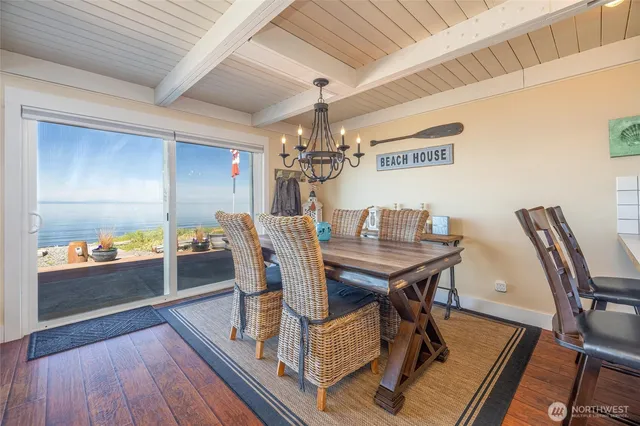 a kitchen with wooden floors and appliances