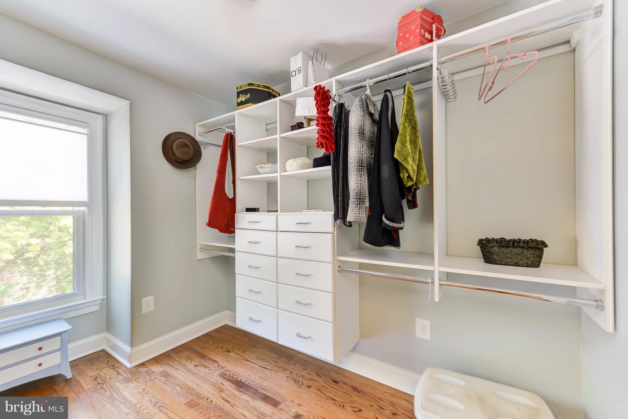 2126 Military Road Arlington, VA 22207 - Photo 21 of 29 a view of walk in closet with clothes and shoes