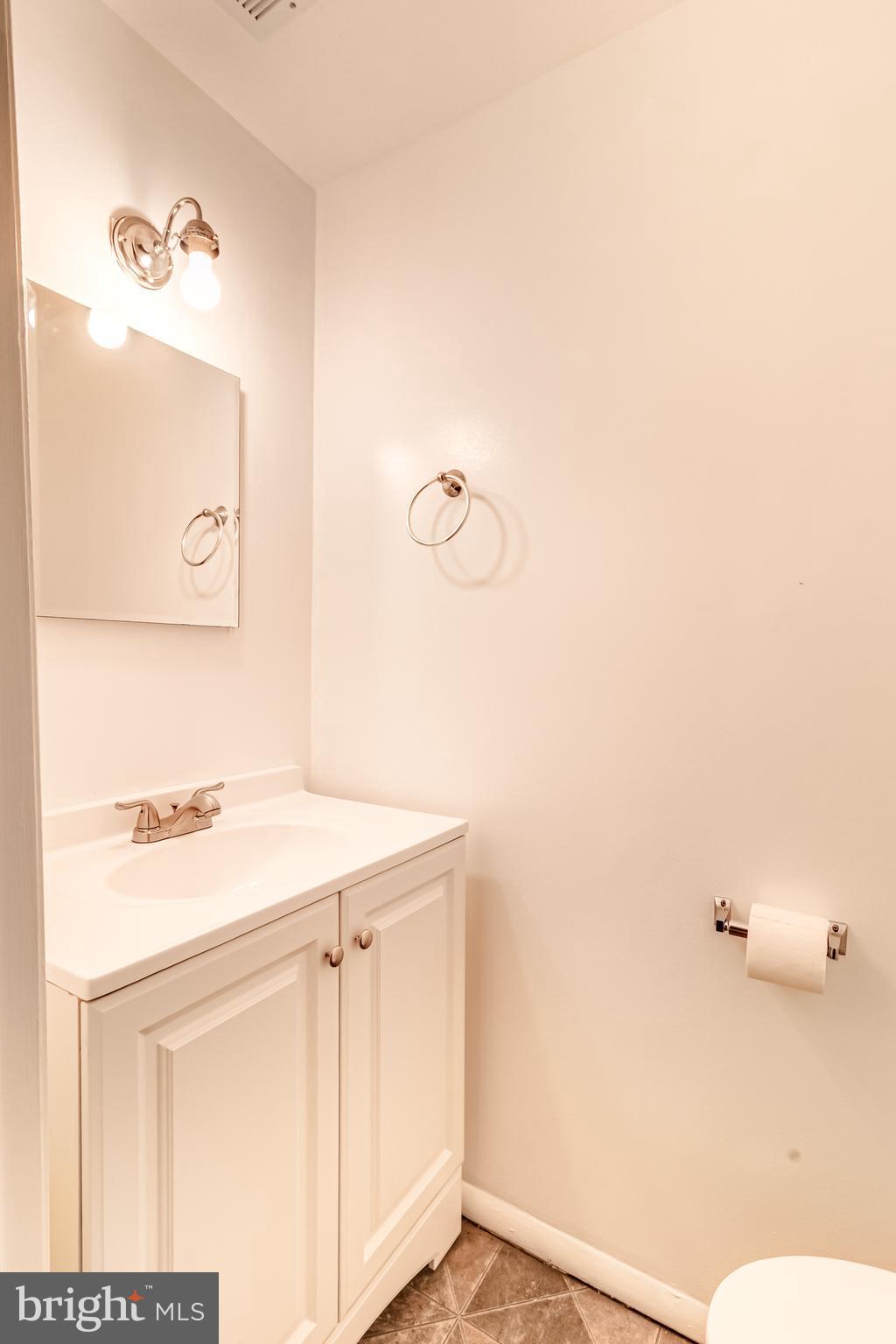 982 Topview Drive Edgewood, MD 21040 - Photo 11 of 25 a bathroom with a sink and a mirror