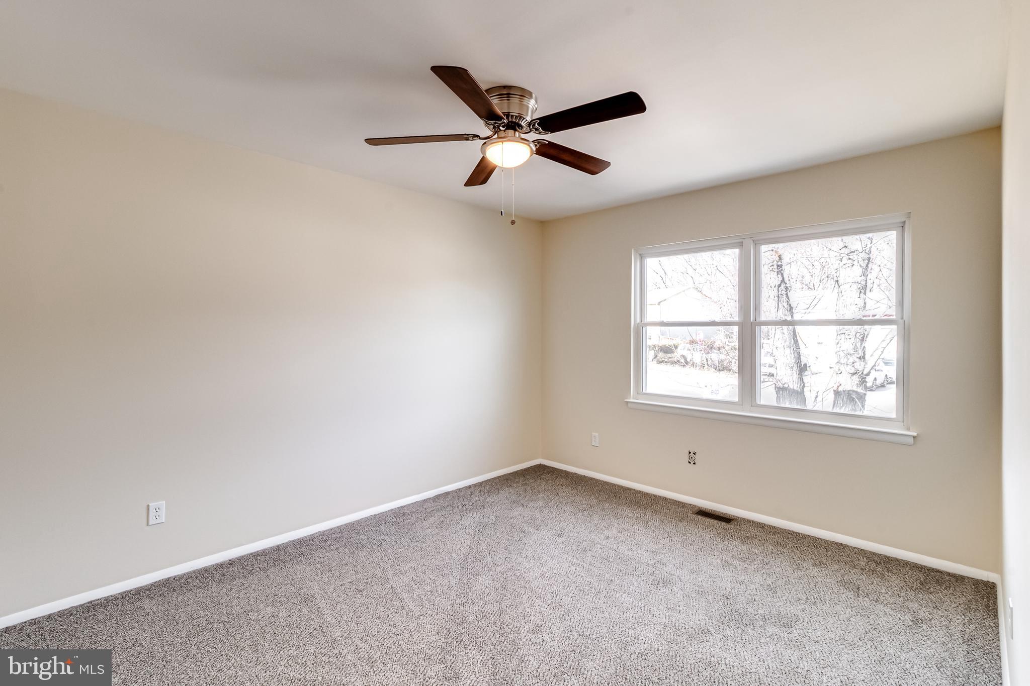 982 Topview Drive Edgewood, MD 21040 - Photo 13 of 25 an empty room with ceiling fan and windows