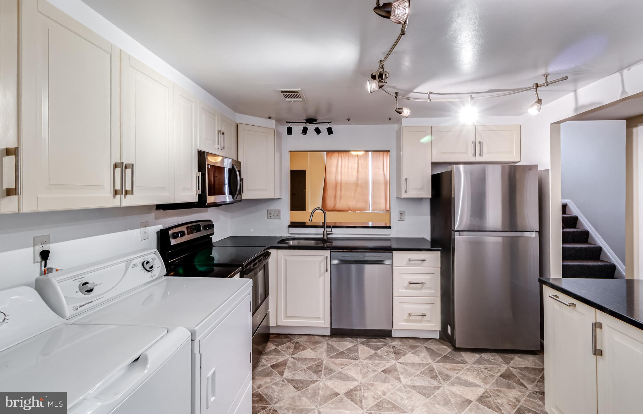 982 Topview Drive Edgewood, MD 21040 - Photo 2 of 25 a kitchen with stainless steel appliances a refrigerator sink and white cabinets