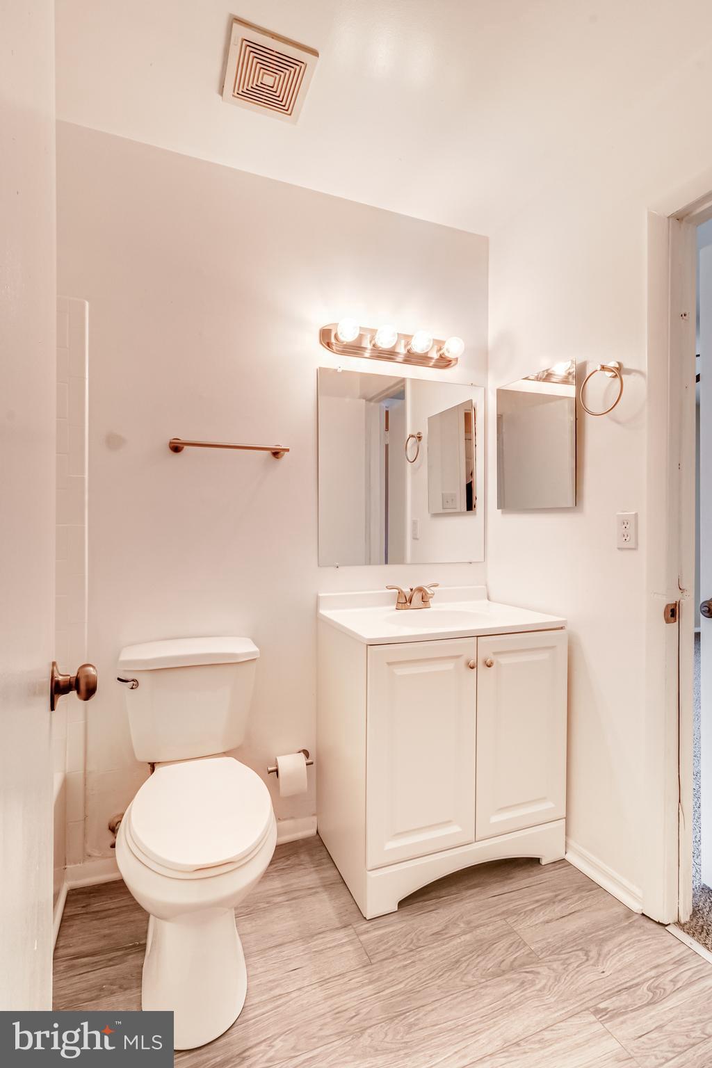 982 Topview Drive Edgewood, MD 21040 - Photo 22 of 25 a bathroom with a toilet a sink and mirror