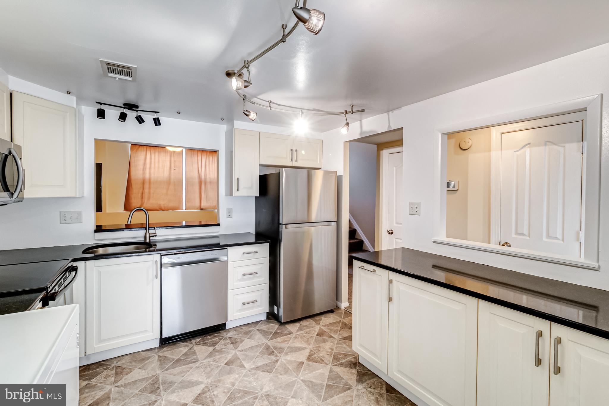 982 Topview Drive Edgewood, MD 21040 - Photo 3 of 25 a kitchen with stainless steel appliances granite countertop a refrigerator sink and cabinets