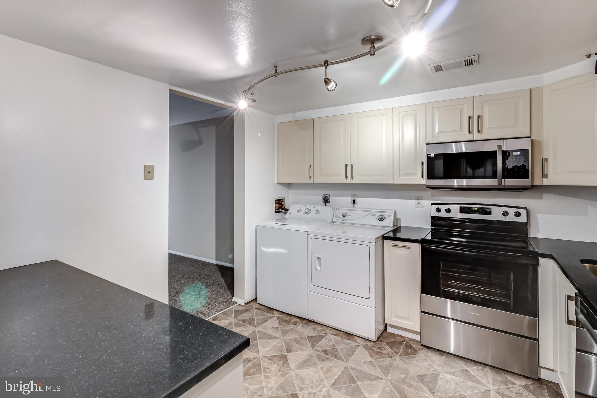 982 Topview Drive Edgewood, MD 21040 - Photo 4 of 25 a kitchen with a sink stove and microwave