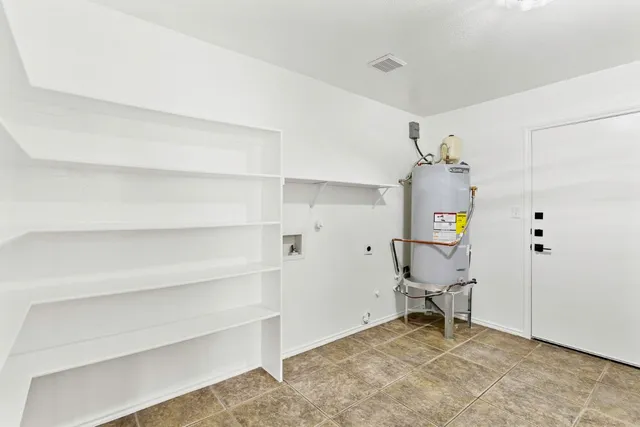a view of room with wooden floor and windows