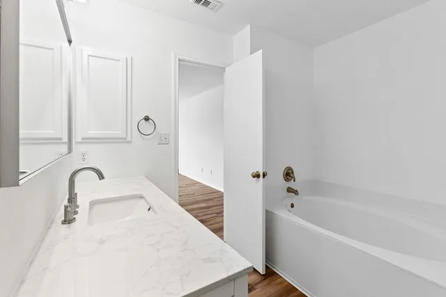 a bathroom with a sink and a bathtub