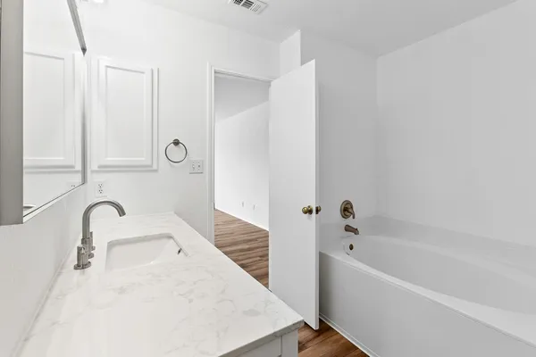 a bathroom with a sink and a bathtub